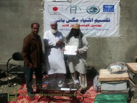 mr-iqbal-hussain-edo-agriculture-district-shangla-distributing-bee-colonies-certificate-a-other-tool-kit-to-the-traineess-upon-successful-completion-of-training-1.jpg